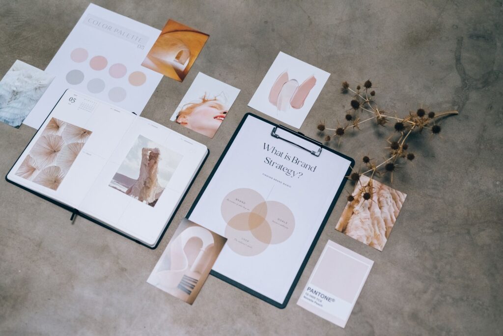 A brand identity moodboard with a colour palette and design materials