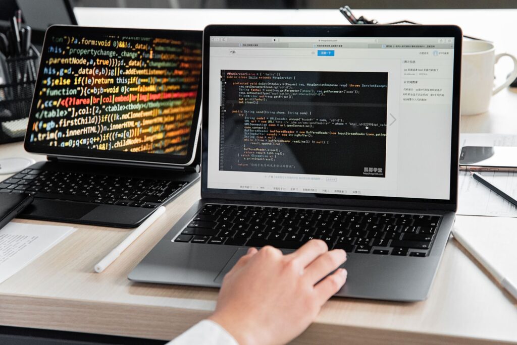A developer building a website on a laptop