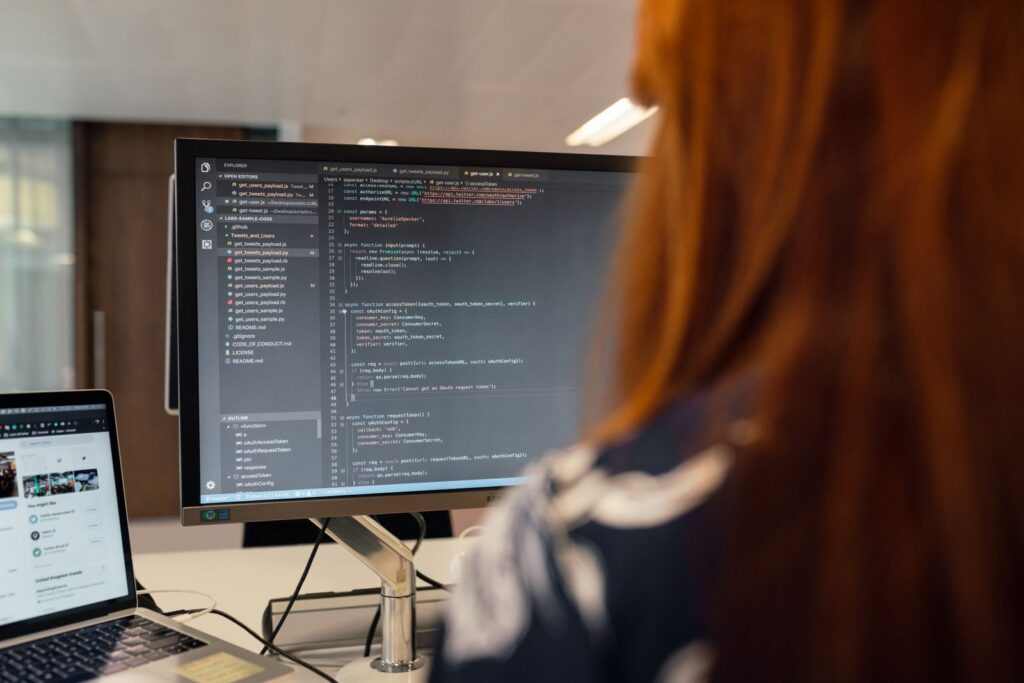 A developer working on website code in a bright office